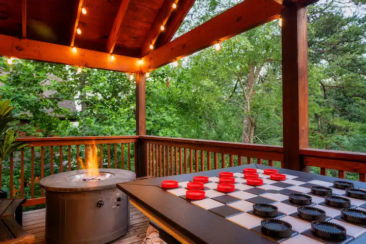 Deck with fire pit table and giant checkers