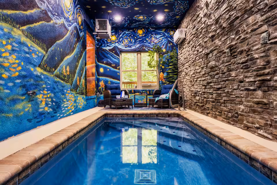 Private indoor pool with Van Gogh mural